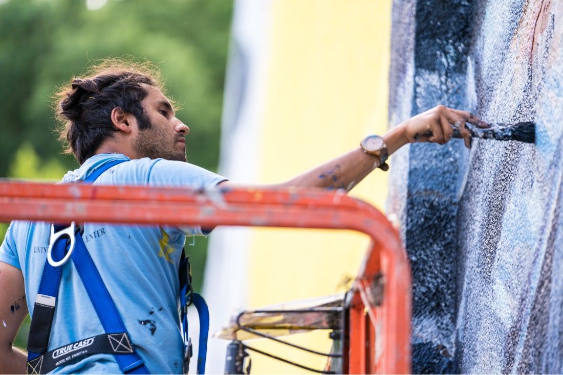 Artist Pepe Gaka painting mural